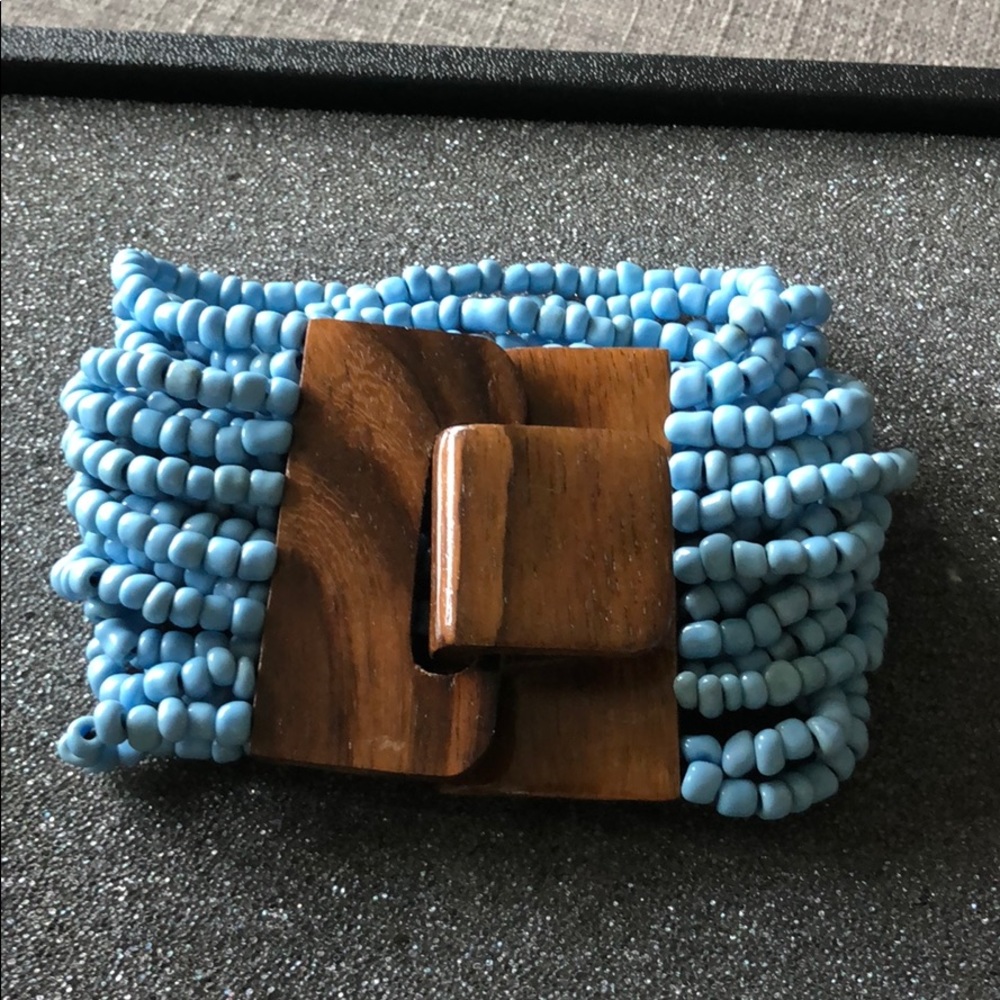Multi strand beads bracelet with wood clasp